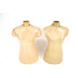 Two fibreglass female mannequin torsos.