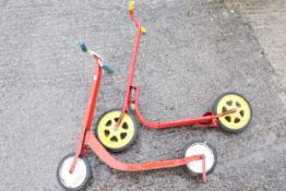 Two vintage children's scooters.
