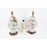 A pair of 20th century lamp bases and a Meissen style lamp base.