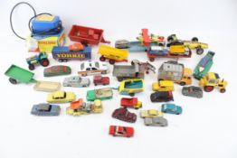 A collection of playworn diecast vehicles.