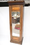 A vintage oak cabinet wardrobe with full length mirror. With moulded cornice.