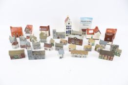 A collection of assorted Wade Whimsies cottages and others.