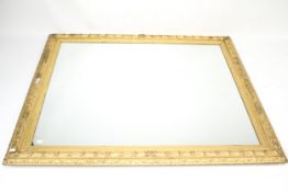 A gilt framed wall mirror.
