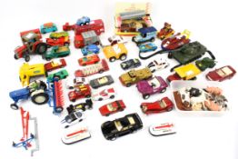 A collection of diecast vehicles and Britains plastic animals.