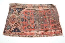 A small Turkish knotted prayer rug.