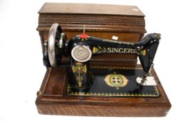 A Singer sewing machine and case.