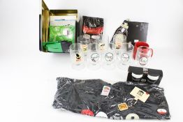 An assortment of Guinness collectables. Including advertising glasses, a mug, etc. Max.