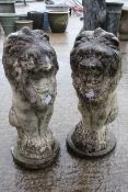 A pair of composite stone lions.