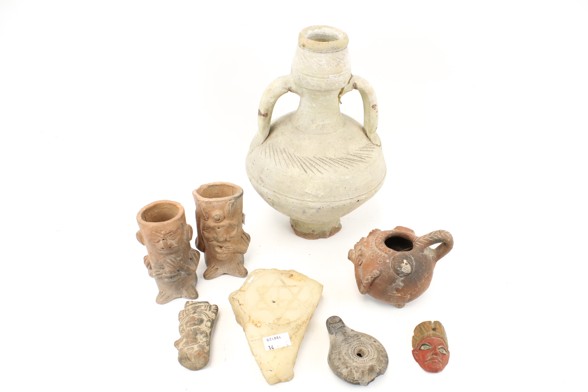 A collection of antique artefacts and pieces of pottery.