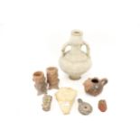 A collection of antique artefacts and pieces of pottery.