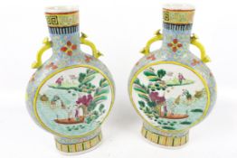 A pair of Chinese Qing period famille rose moon flasks.
