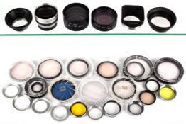 A collection of camera filters. Including Hoya 52mm, Asahi Pentax Skylight 52mm, etc.