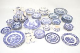 An Ironstone tea and dinner service in the 'Old Willow' pattern and a Ross plates and bowls in the