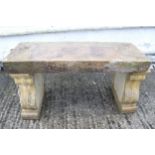 A composite stone garden three piece bench.