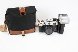 An Olympia camera and bag.