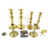 A collection of 20th century brass candlesticks.
