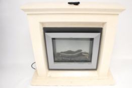 A contemporary reconstituted marble fire surround and Dimplex electric log effect fire. Model VAL15.