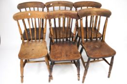 Two sets of three wooden chairs.