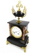A black slate marble eight-day mantel clock.
