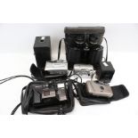 An assortment of vintage cameras and binoculars.