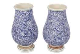 A pair of Japanese Kyo-Satsuma vases with blue dotted decoration.