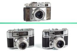 Three vintage German Braun film cameras.