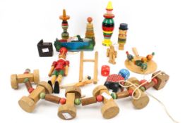 A collection of assorted vintage wooden toys. Including 'Pinocchio', stacking and animated, etc.