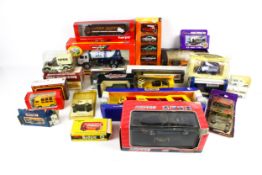 A collection of boxed diecast. Including a Budgie Routemaster, Dinky, Matchbox, etc.