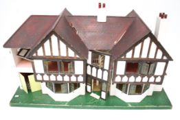 A vintage Tri-ang 'Stockbroker' mock-Tudor dolls house.