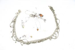 A collection of silver and white metal jewellery. Including necklaces, chains, a pendant, etc.