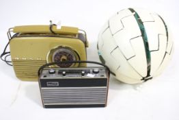 Two retro portable transistor radios and an Ikea expanding pendant ceiling lamp shade.