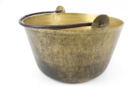 A large brass preserve pot.
