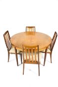 Vintage Retro : A teak circular extending dining table and four chairs.