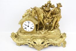 A vintage eight-day cast metal mantel clock.