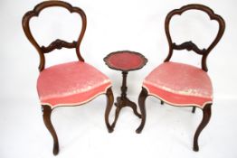 A pair of Victorian balloon back chairs and a wine table.