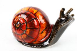 A signed Anita Harris art pottery snail. H13.