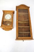 A pine display cabinet plus a pine wall clock. Max.