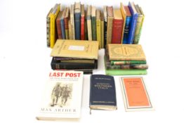 An assortment of military related books.