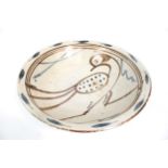 Studio Pottery : A large stoneware pottery bowl decorated with a bird. Circa H11cm x diameter 44.