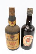 Two vintage bottles of alcohol.