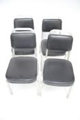 A set of four Burgess American style stacking chairs.