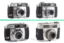 Four vintage Balda Baldessa 35mm film cameras.