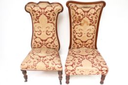 Two mahogany framed prie-dieu chairs with matching upholstery.