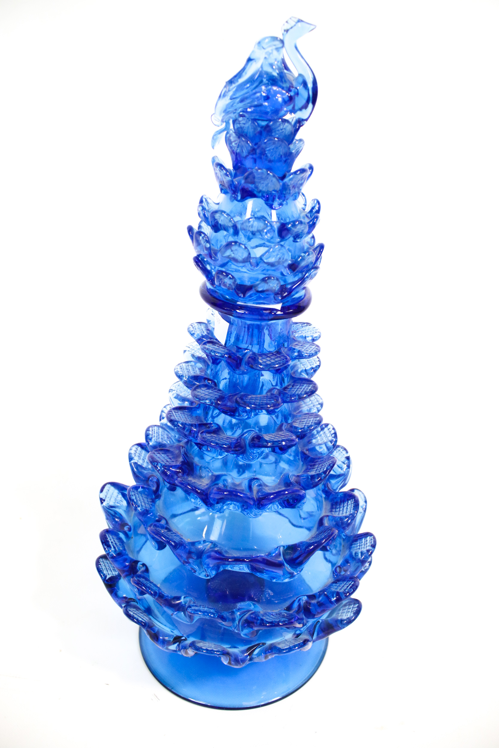 A large vintage hand blown blue glass vase with stopper.