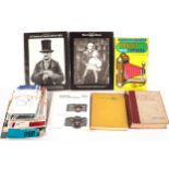 An assortment of photography books and camera manuals.