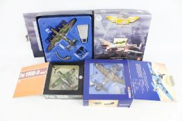 A collection of three model aircraft.