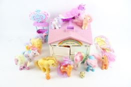 A collection of assorted 'My Little Pony' toy horses and accessories.