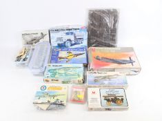 A collection of assorted vintage plastic model kits.