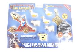 A Ye Olde Monty Python Cow Catapult deluxe set. To include the special bonus free wooden rabbit.