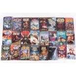 A collection of Star Wars and Star Trek fiction paperback books.